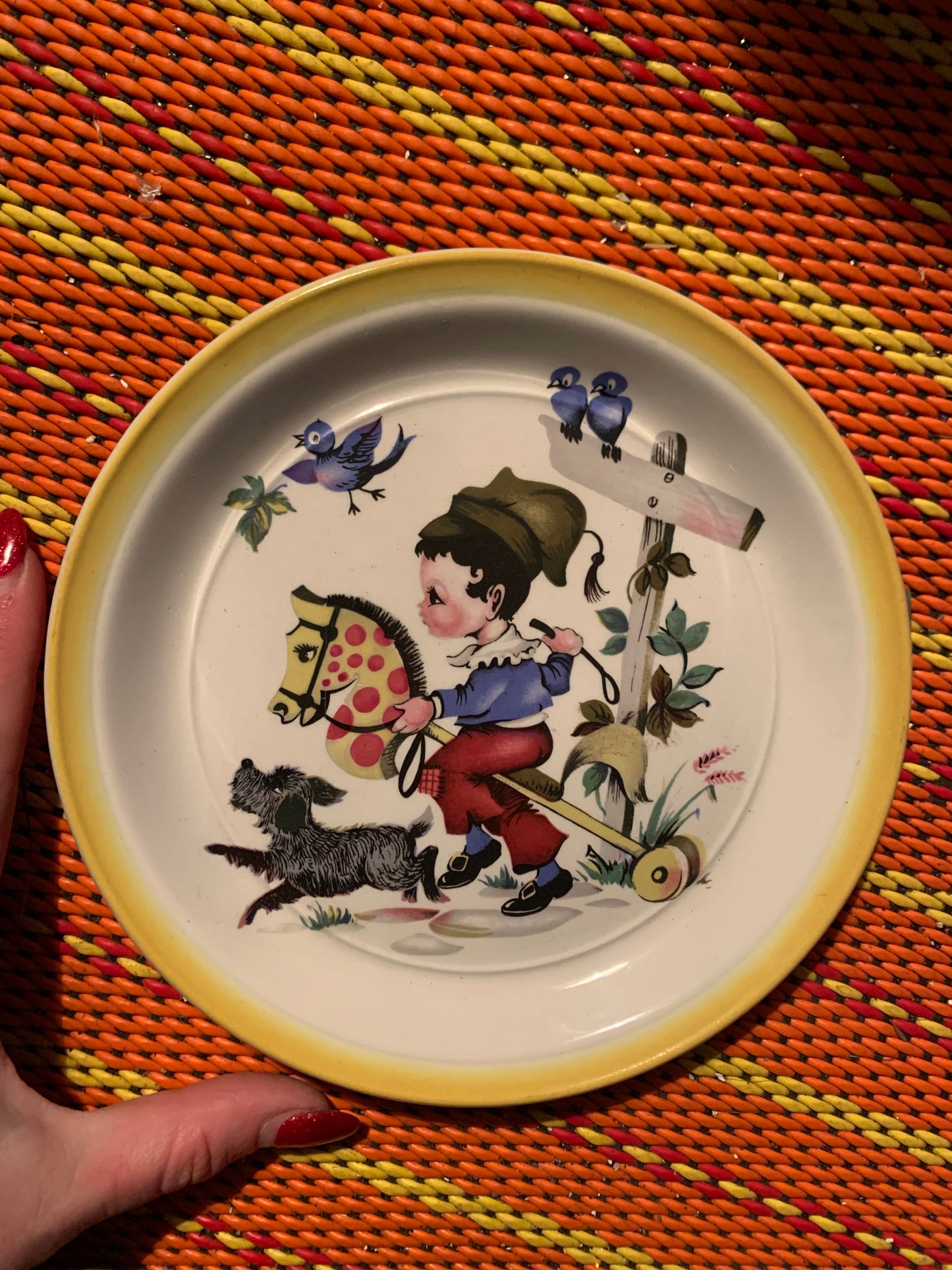 Retro plate little boy on horse