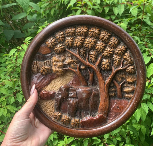 Carved wooden elephant plaque